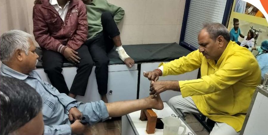 Doctors examining leprosy-affected patients at Samarpan Kushth Chikitsa Kendra, Tahirpur, Delhi